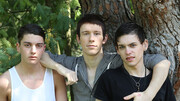 Skinny boys please each other in outdoor anal threesome