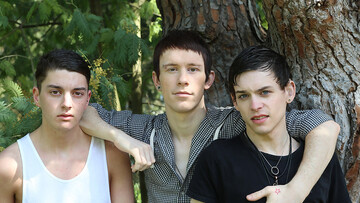 Skinny boys please each other in outdoor anal threesome