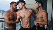Fine male gets shared by two hunks in superb gay threesome