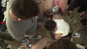 Guys watch TV and gang-fuck a slutty bottom