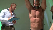Two men with great bodies are tormenting a muscular lad