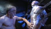His entire body is covered and his cock gets toyed with