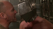 Putting a helmet on his head and using his body and cock