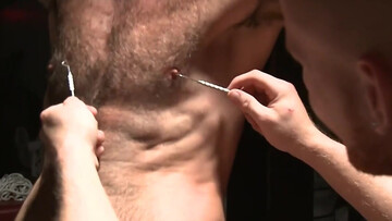 Dominant stud is punishing the nipples of a sub fellow