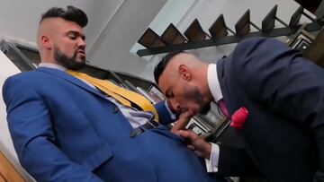 Wearing a suit and having office sex with a tall hunk