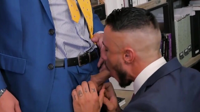Wearing a suit and having office sex with a tall hunk
