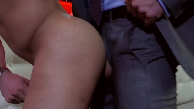 Man in a suit fucking a male stripper in the empty club