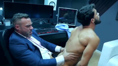 Latino with a beard riding his muscular boss at work
