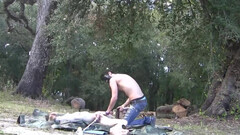 Camping bros have fun pulling each other's balls