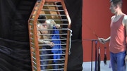 Caged boy is being whipped and seduced through BDSM