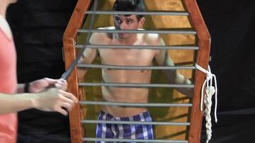 Caged boy is being whipped and seduced through BDSM