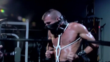 Muscular male slave is captive and set to endure merciless cock in ass