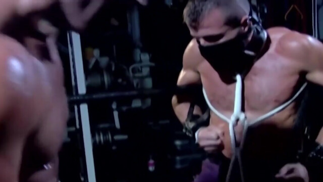 Muscular male slave is captive and set to endure merciless cock in ass