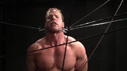 Muscular DILF stands restrained and ready for his punishment