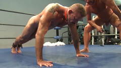 Nude men fuck in the ring after a rough bondage play