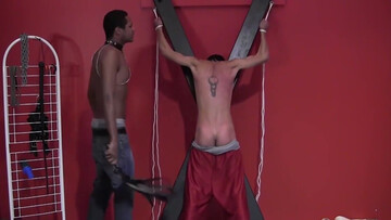 Lucas is tied up and whipped by the black stud