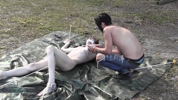 Skinny twink gets spanked and clamped in outdoor bondage treat
