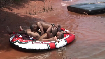 Wet action next to a boat for some horny black dudes
