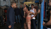 A bunch of mechanics having their way with one stud