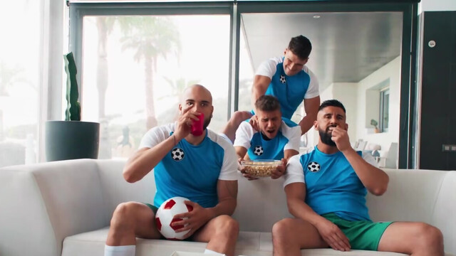 Sporty dudes getting off while watching the game
