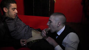 Clothed men play elegant anal games in a steamy encounter